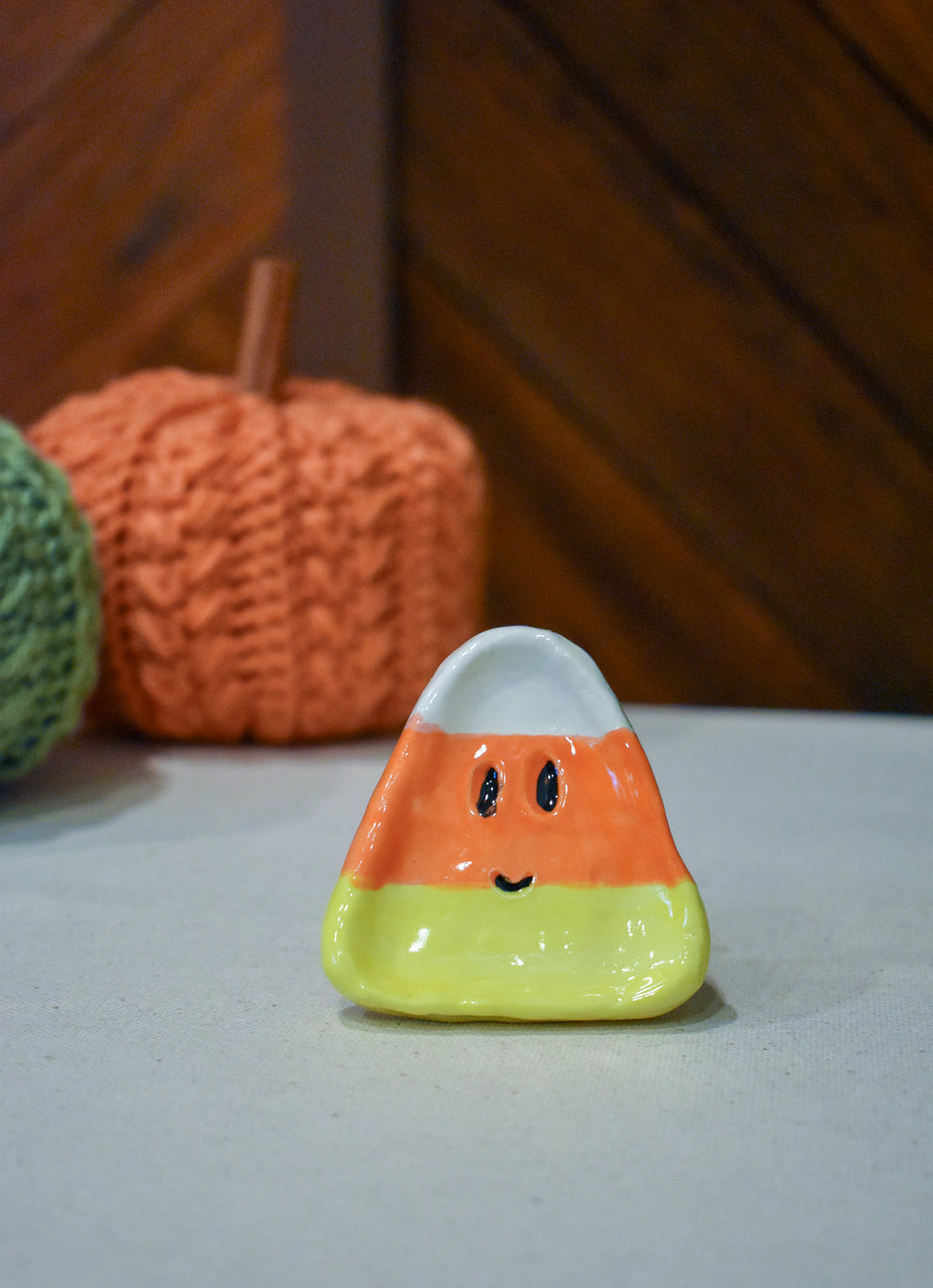 Hand-sculpted ceramic candy corn ring dish in white, orange, and yellow