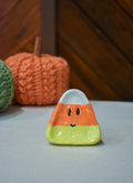 Hand-sculpted ceramic candy corn ring dish in white, orange, and yellow