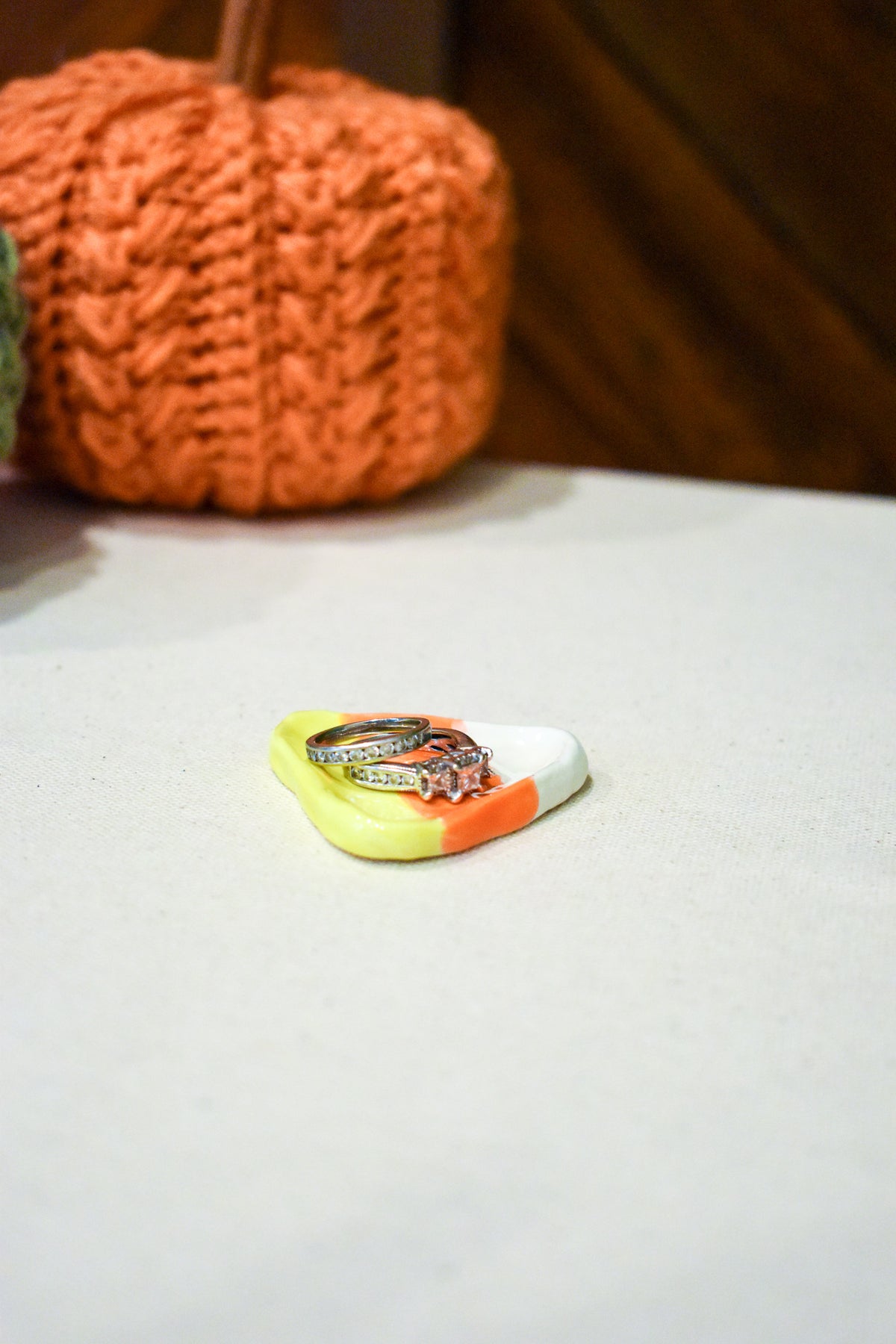 Hand-sculpted ceramic candy corn ring dish in white, orange, and yellow