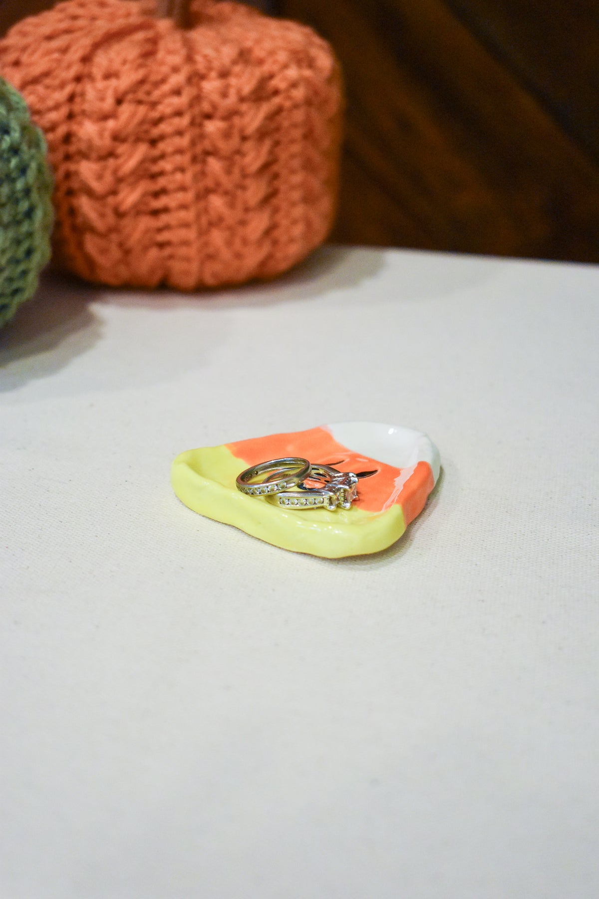 Hand-sculpted ceramic candy corn ring dish in white, orange, and yellow