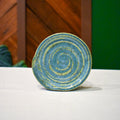 Hand-thrown spiral spoon rest in Creekstone, bright aqua-teal with lime breaks
