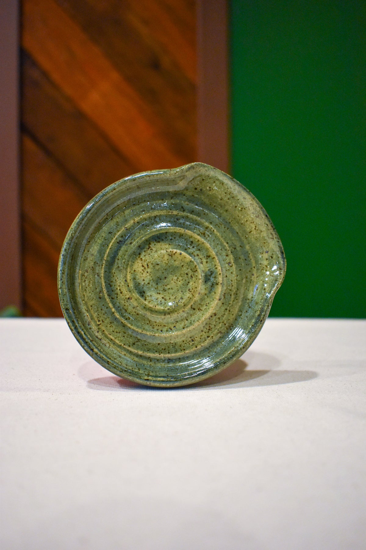 Hand-thrown spiral spoon rest in Canopy, olive and blue-green