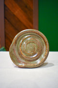 Hand-thrown spiral spoon rest in Wild Thyme, soft olive-sage with rosy speckle