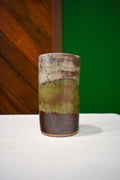 Hand-thrown ceramic travel mug in Autumn Hills, cream, olive, and chocolate brown