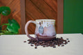Hand-thrown mug in Orchard Mist, cream drips over dusty rose and deep wine red