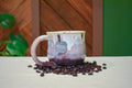 Hand-thrown mug in Orchard Mist, cream drips over dusty rose and deep wine red