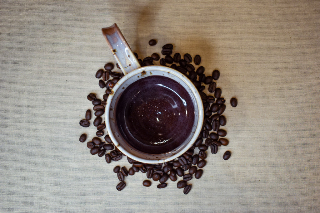 Hand-thrown mug in Orchard Mist, cream drips over dusty rose and deep wine red
