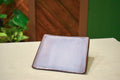 Hand-formed square catch-all dish in Stone Lavender, soft lavender framed by a deep iron-brown rim