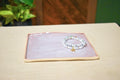 Hand-formed square catch-all dish in Lavender Mist, matte lavender and peach with deeper plum along the raised edge