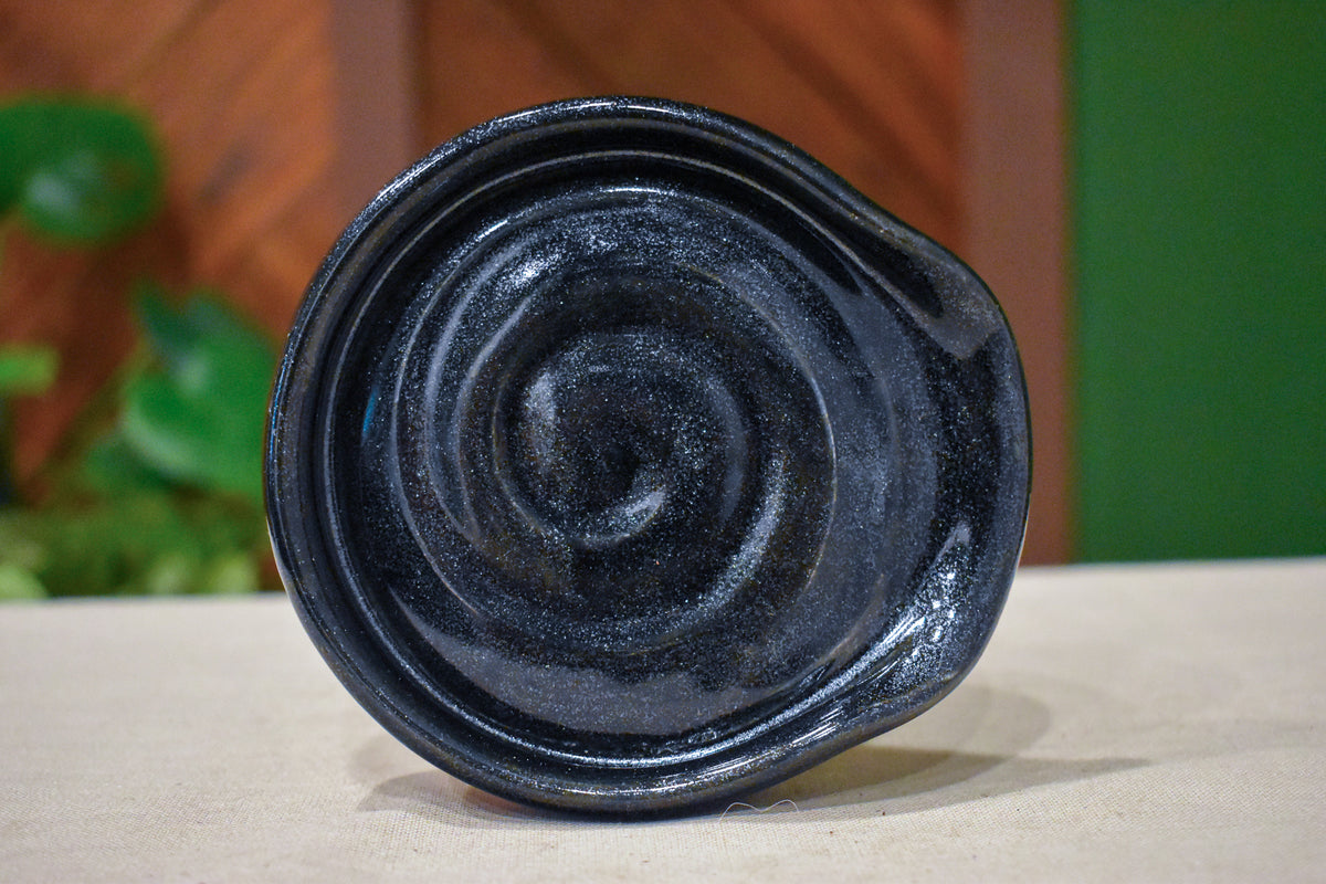 Hand-thrown spiral spoon rest in Nightfall, deep obsidian black with fine sparkle
