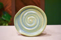 Hand-thrown spiral spoon rest in Ivy, soft celadon green matte glaze