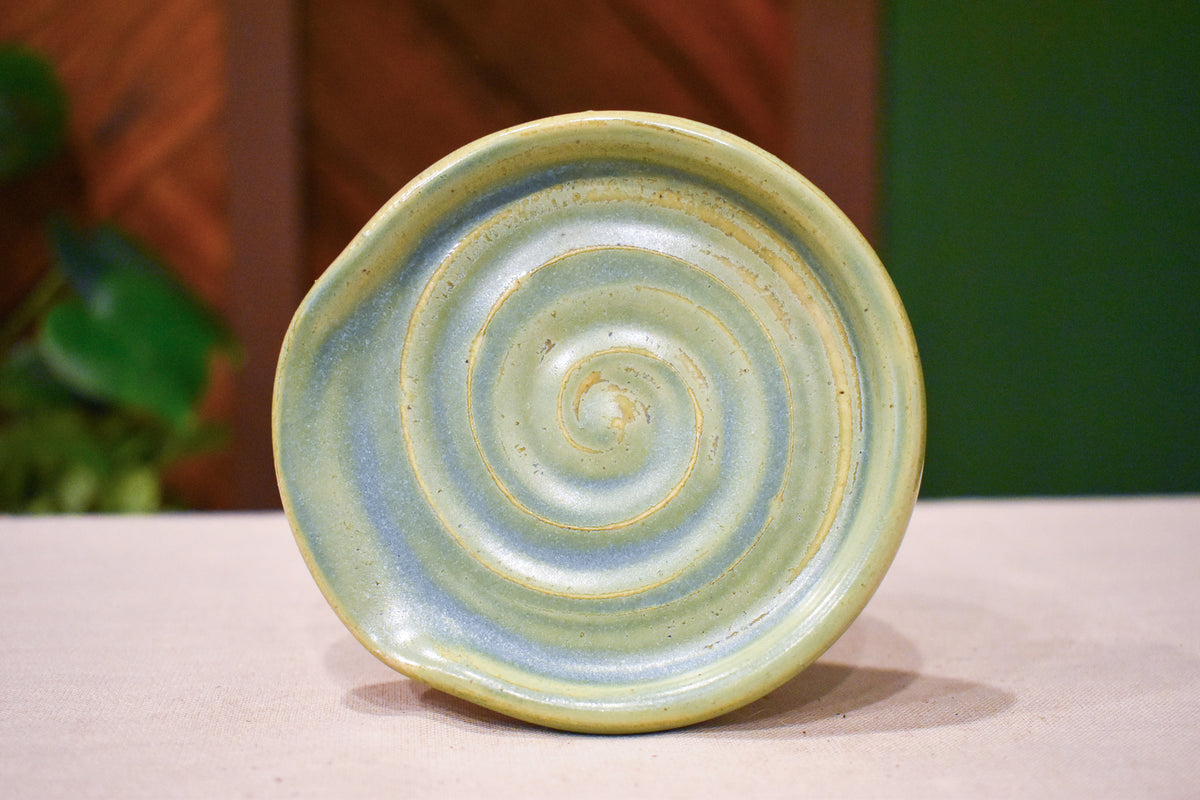 Hand-thrown spiral spoon rest in Ivy, soft celadon green matte glaze