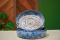 Pair of hand-thrown tall-walled plates (blates) in Coastal Hollow, cobalt blue glaze with warm rust-amber breaks