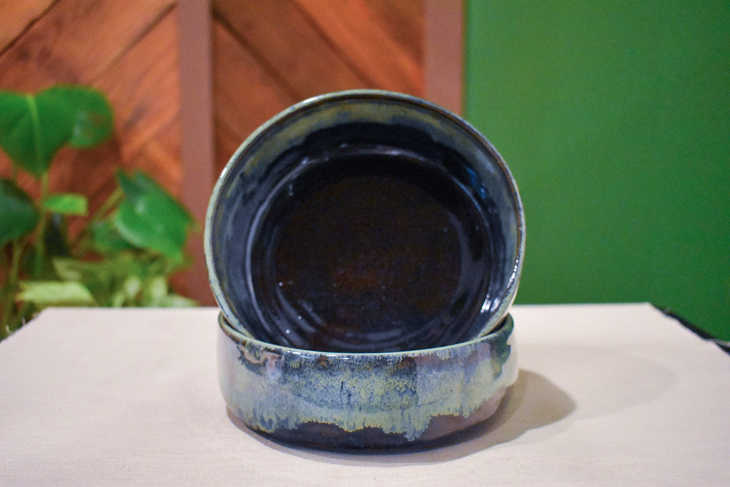 Pair of hand-thrown tall-walled plates (blates) in Mossy Hollow, deep indigo shifting to soft sage along the upper walls