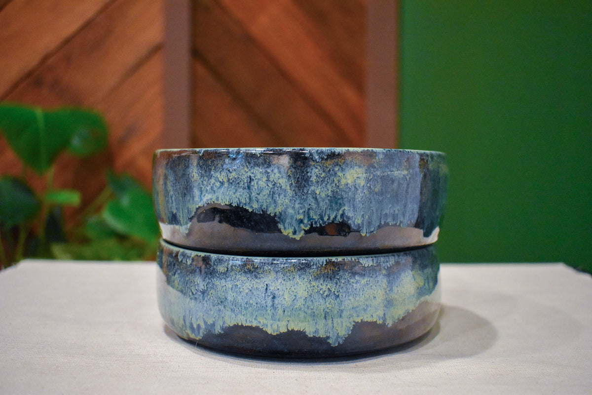 Pair of hand-thrown tall-walled plates (blates) in Mossy Hollow, deep indigo shifting to soft sage along the upper walls