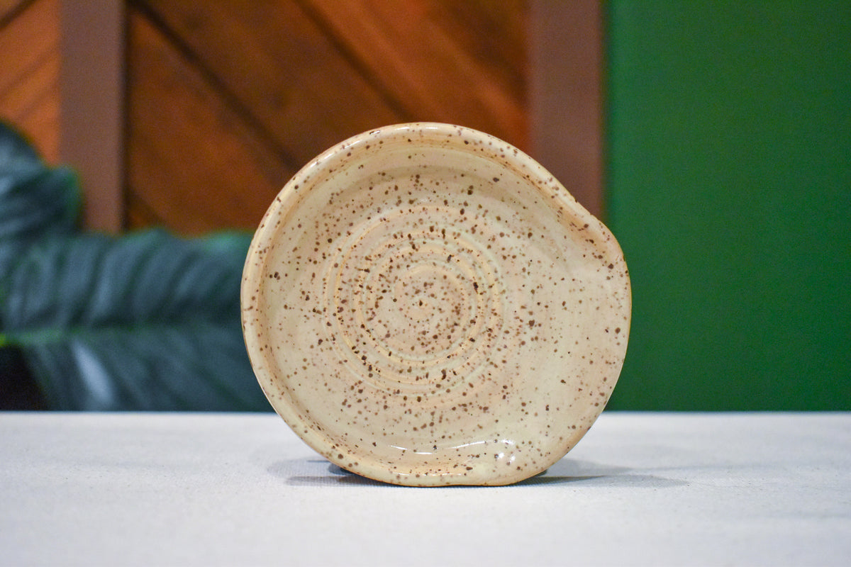 Hand-thrown spiral spoon rest in Birch, warm oatmeal cream with fine brown speckle