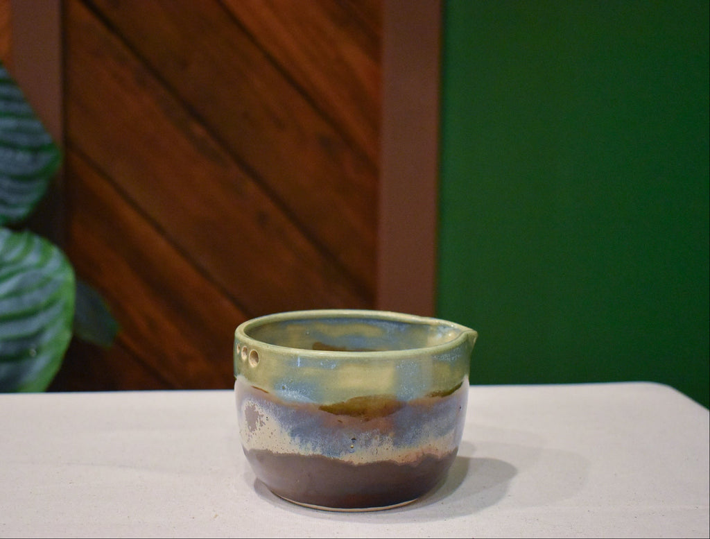 Hand-thrown prep bowl with garlic grater and pour spout in Dusk Meadow, sage over metallic copper and rust