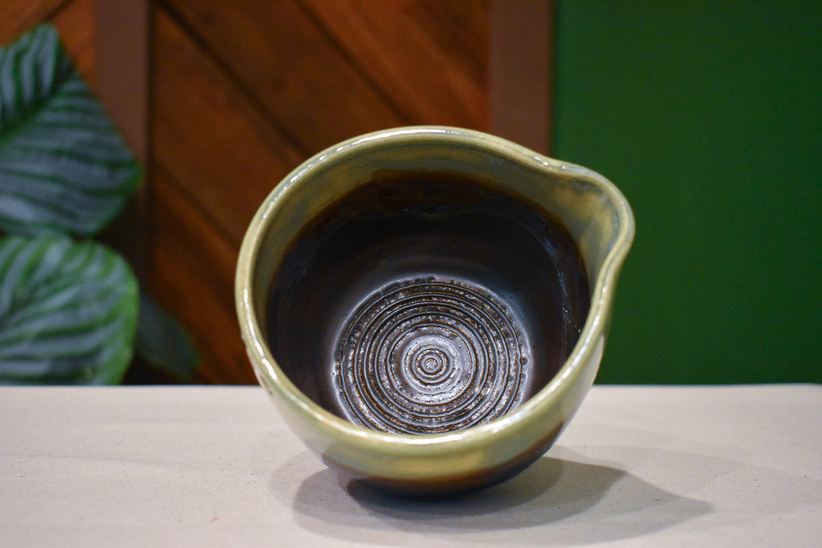Hand-thrown prep bowl with garlic grater and pour spout in Dusk Meadow, sage over metallic copper and rust