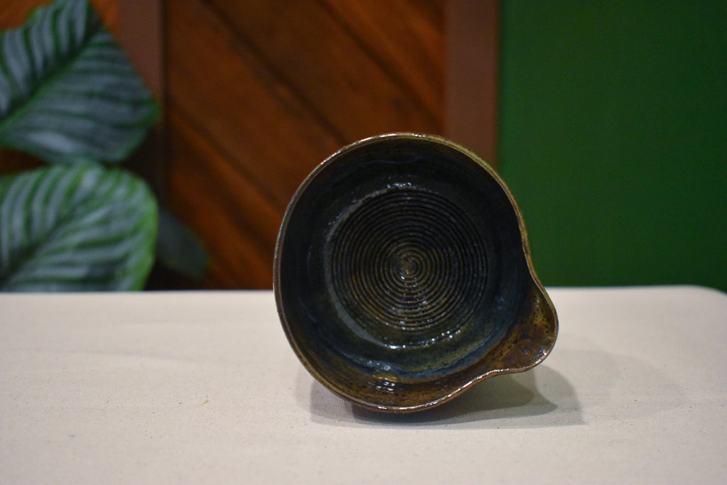 Hand-thrown prep bowl with garlic grater and pour spout in Forest Floor, deep moss and olive with amber and rust