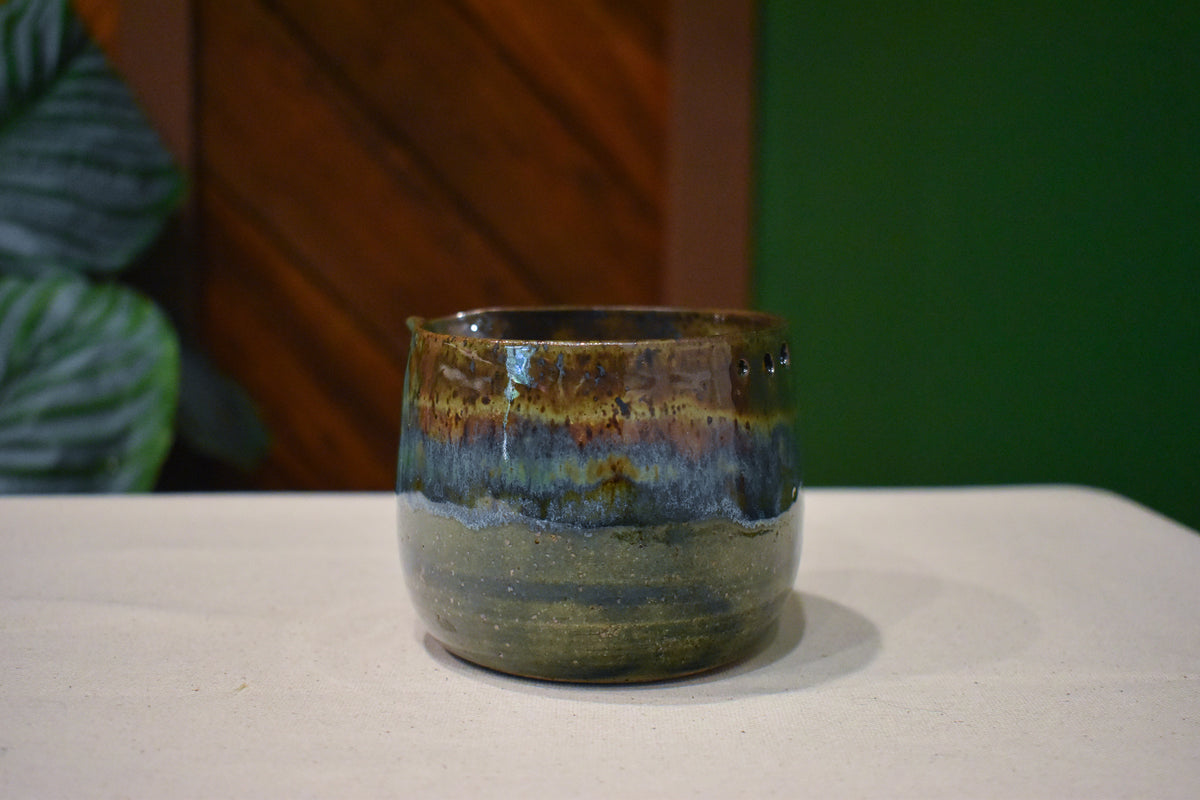 Hand-thrown prep bowl with garlic grater and pour spout in Forest Floor, deep moss and olive with amber and rust