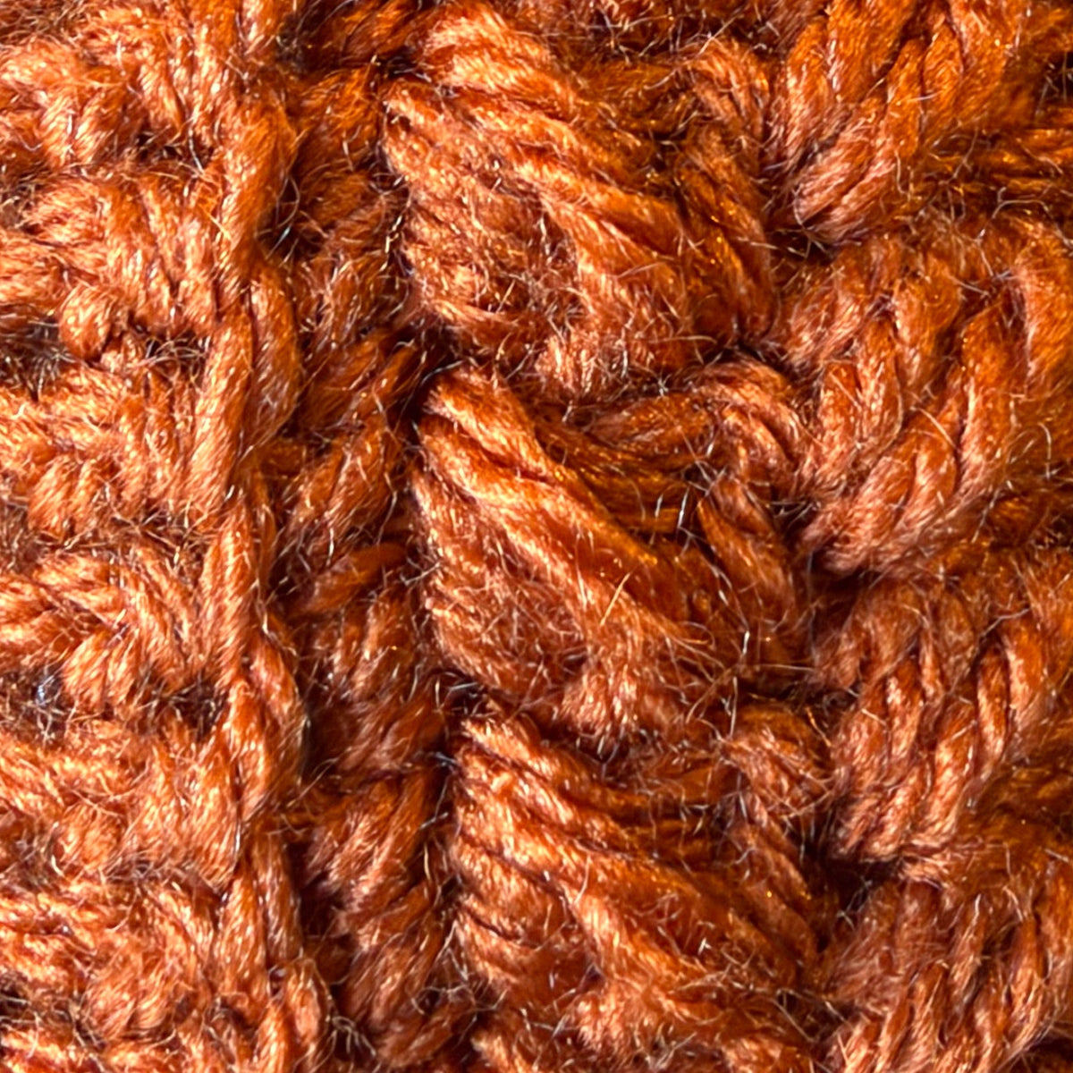 Close-up of crochet stitches in Burnt Pumpkin, a deep rusty orange