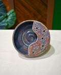 Hand-thrown ceramic berry bowl with a hand-punched drain panel, in slate-blue and plum Elderberry